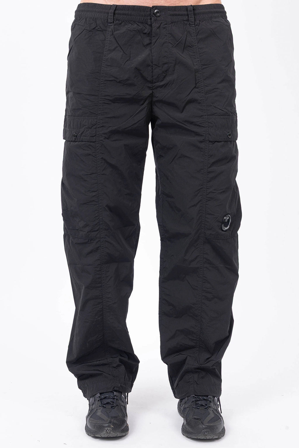 C.P. Company, Mens Pants, Black 999, Chrome-R Polyamide Nylon Trousers, Cargo Pockets, Side Pockets, Signature Lens, Lens Detail, Loose Fit, Straight Leg, Belt Loops, Zip-Fly, Button Closure, Back Pockets, British Saylor, Chester Perry, Massimo Osti, Front Portrait. 