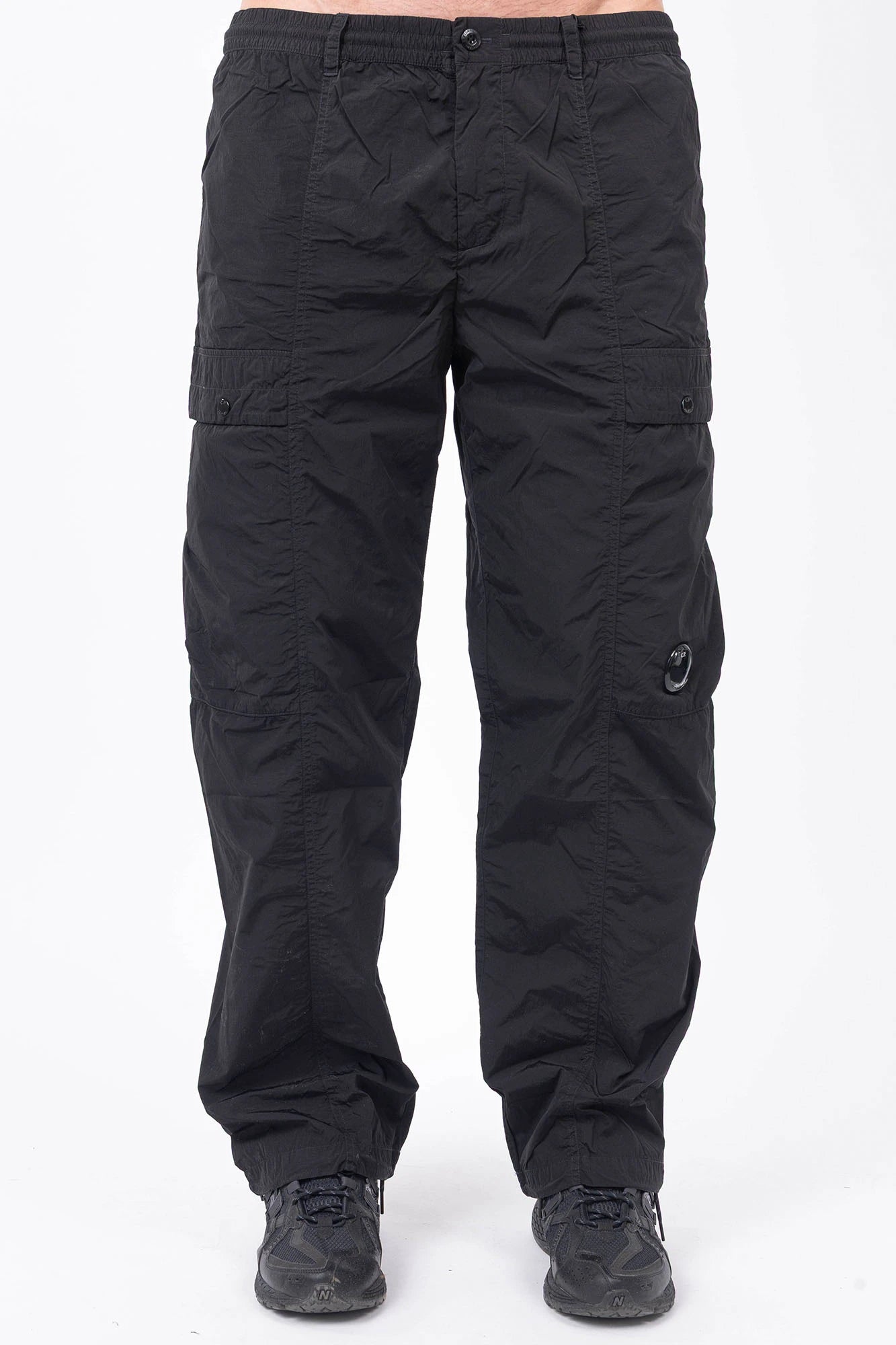 C.P. Company, Mens Pants, Black 999, Chrome-R Polyamide Nylon Trousers, Cargo Pockets, Side Pockets, Signature Lens, Lens Detail, Loose Fit, Straight Leg, Belt Loops, Zip-Fly, Button Closure, Back Pockets, British Saylor, Chester Perry, Massimo Osti, Front Portrait. 