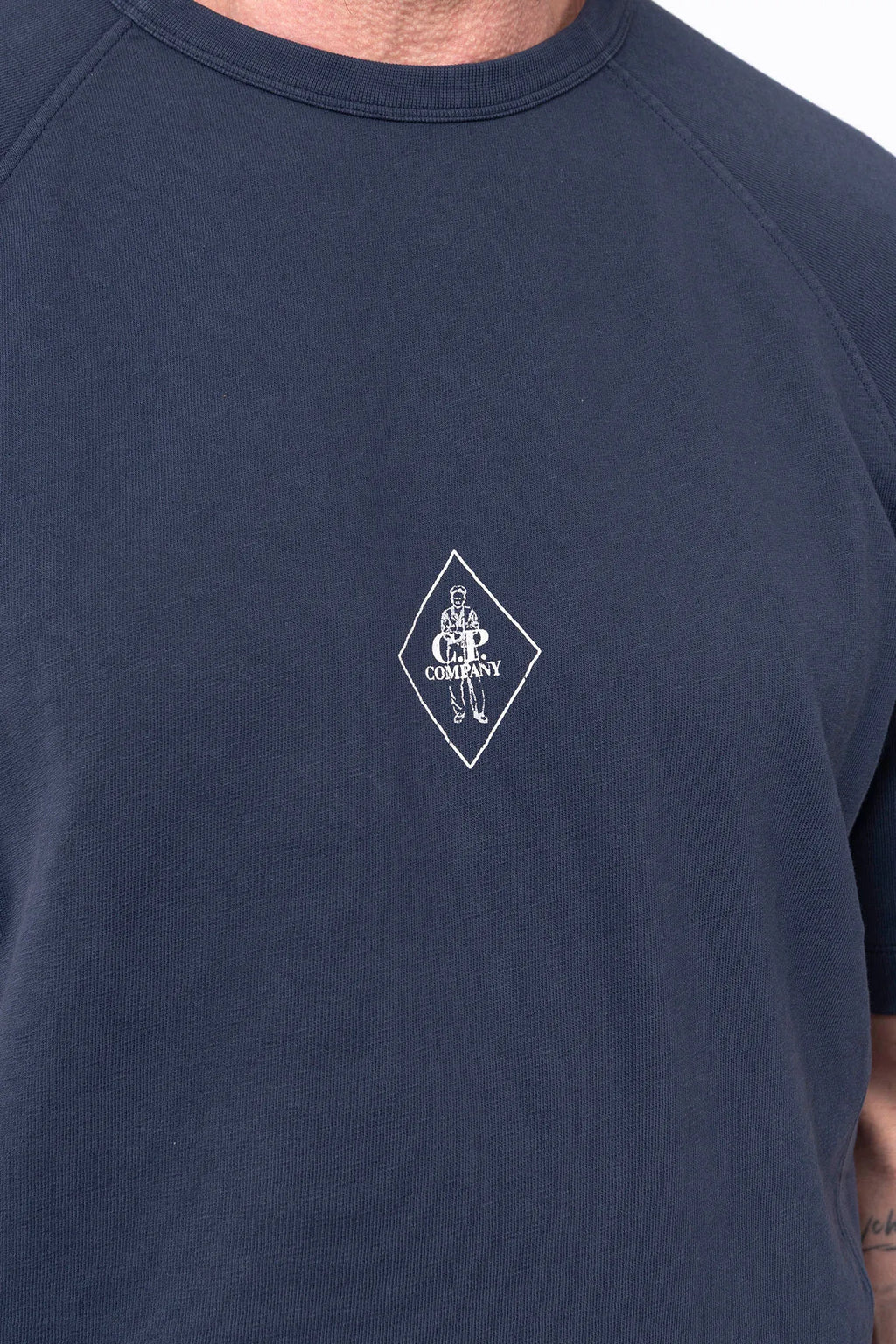 C.P. Company, Mens T-Shirt, Midnight Blue 889, Chest Printed Logo, British Saylor, White Print, Shor Sleeves, Ribbed Hem and Neck, 100% Organic Cotton, Massimo Osti, Chester Perry, Chest Print Close-up. 