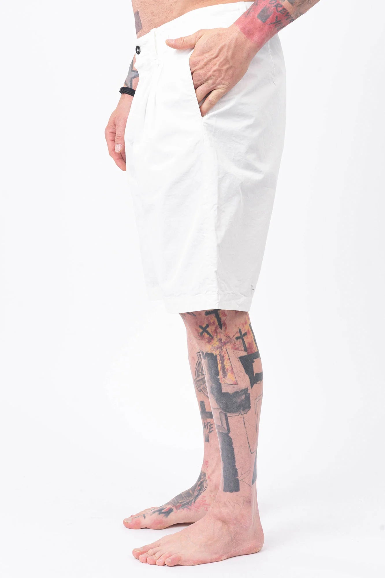 C.P. Company, Mens Shorts, Gauze White 103, Side and Back Pockets, Belt Loops, Button Closure, Breathable, Garment Dyed, Worn-in Look, Gabardine Cotton, Cotton-Polyester Lining, Hand in Pocket Side View. 