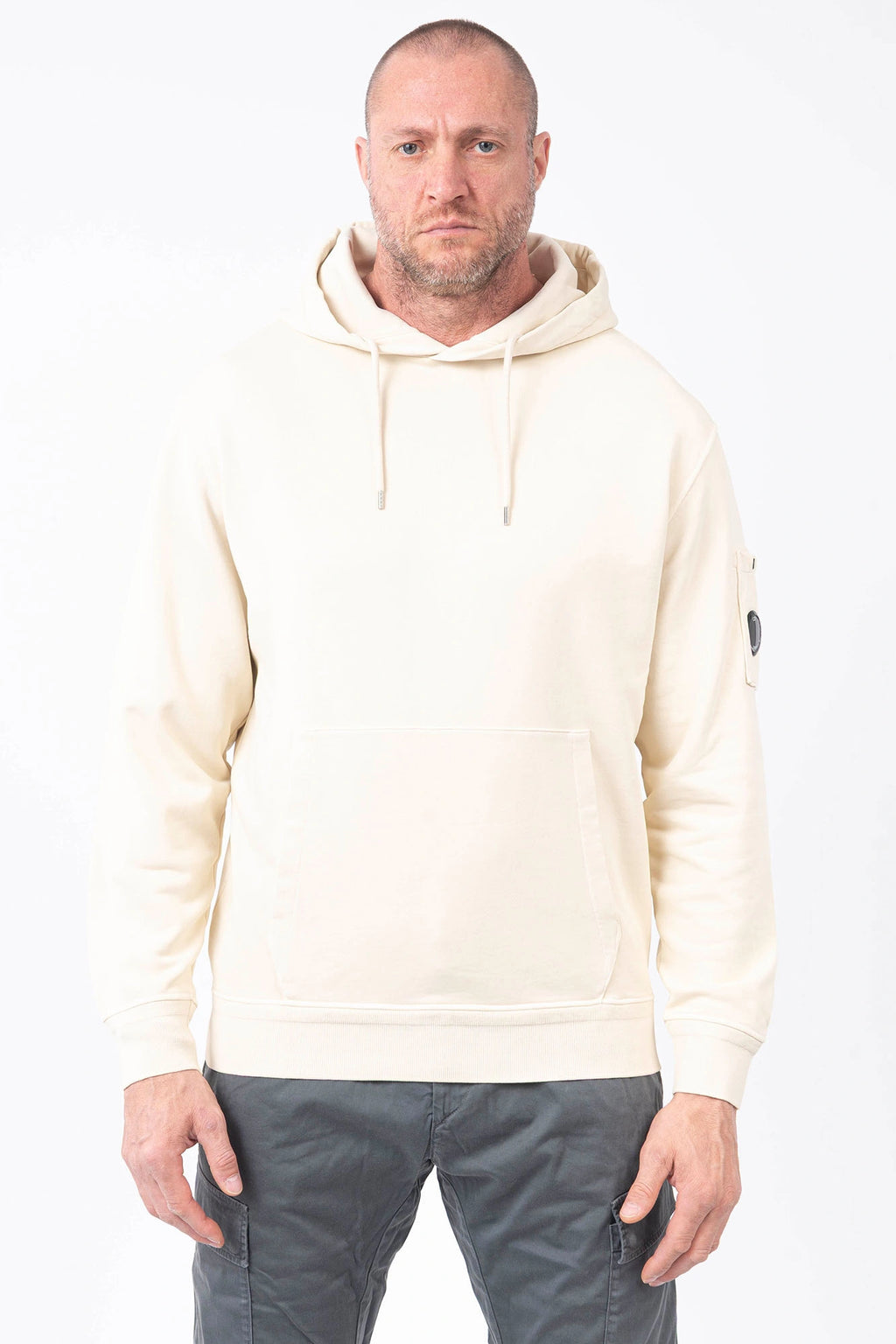C.P. Company, Mens T-Shirt, Frozen Dew 114, White, Off-White, Ivory, Hooded, Lens Sleeve Pocket, Ribbed Hem, Ribbed Cuffs, Kangaroo Pocket, Drawstring Hood, Silver Tone Drawstring Details, C.P. Company Grey Cotton Cargo Pants, Massimo Osti, Chester Perry, British Saylor, Front Portrait. 