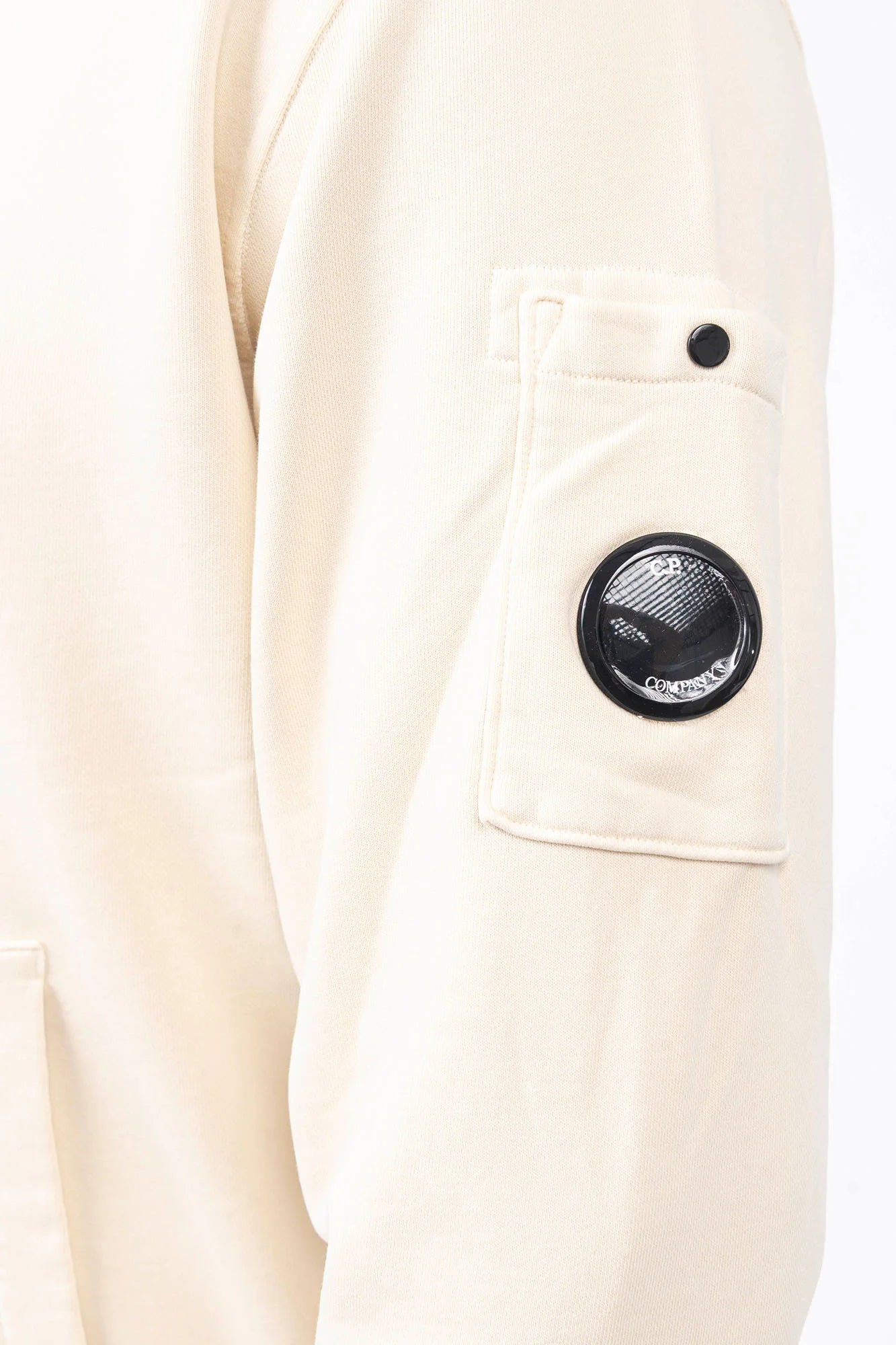 C.P. Company, Mens T-Shirt, Frozen Dew 114, White, Off-White, Ivory, Hooded, Lens Sleeve Pocket, Ribbed Hem, Ribbed Cuffs, Kangaroo Pocket, Drawstring Hood, Silver Tone Drawstring Details, C.P. Company Grey Cotton Cargo Pants, Massimo Osti, Chester Perry, British Saylor, Sleeve Pocket Close-up. 