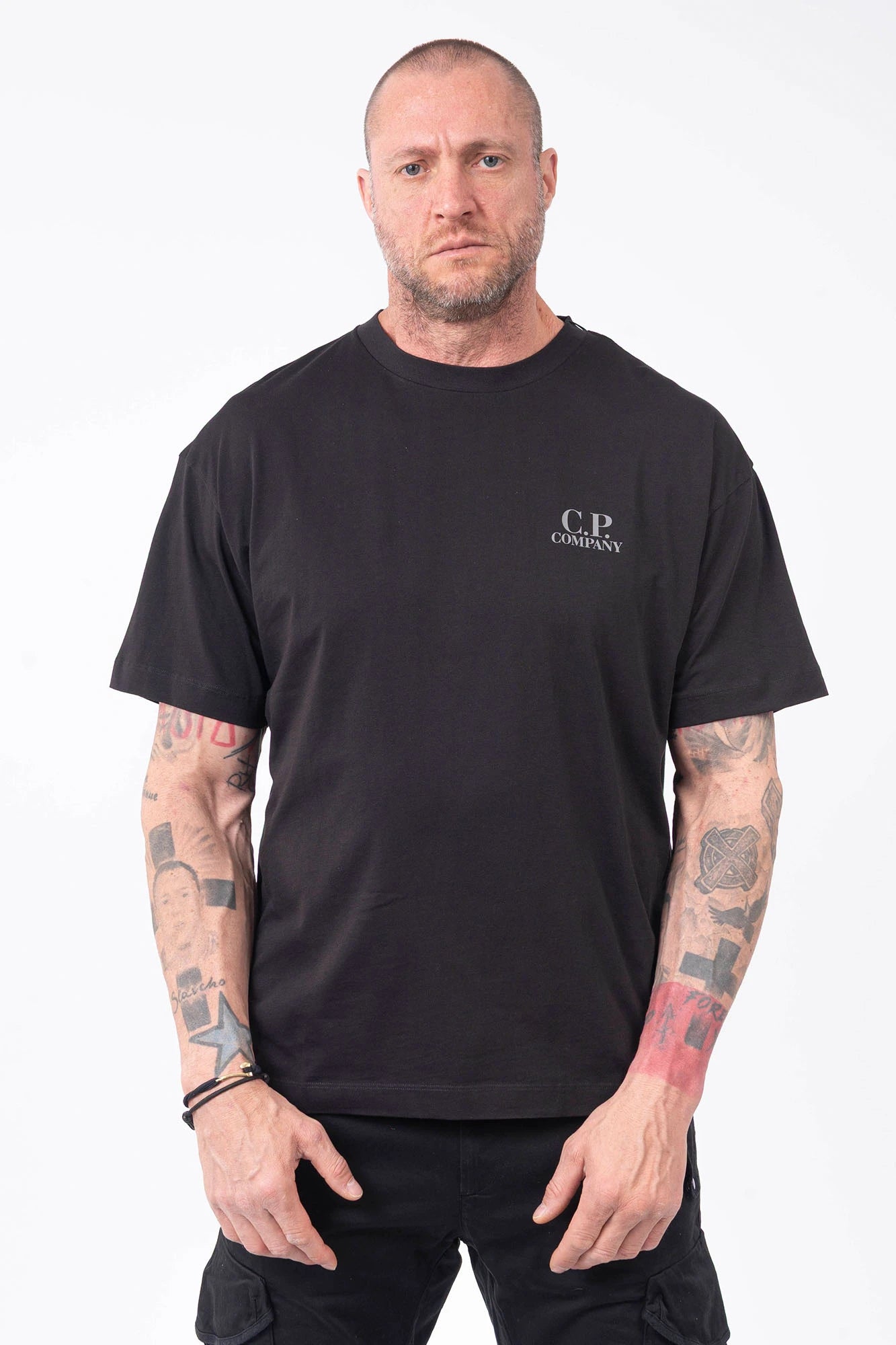C.P. Company, Mens T-Shirt, Black 999, Chest and Back Print, Short Sleeves, Ribbed Hems and Neck, Crew Neck, Grey logo print, Breathable, Massimo Osti, Chester Perry, British Saylor, Front Portrait. 