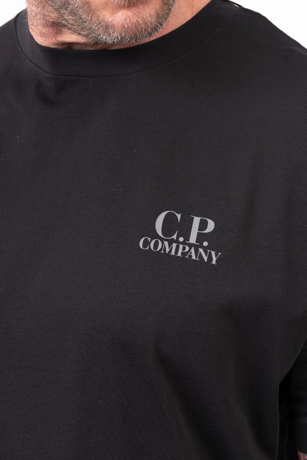 C.P. Company, Mens T-Shirt, Black 999, Chest and Back Print, Short Sleeves, Ribbed Hems and Neck, Crew Neck, Grey logo print, Breathable, Massimo Osti, Chester Perry, British Saylor, Chest Print Close-up. 