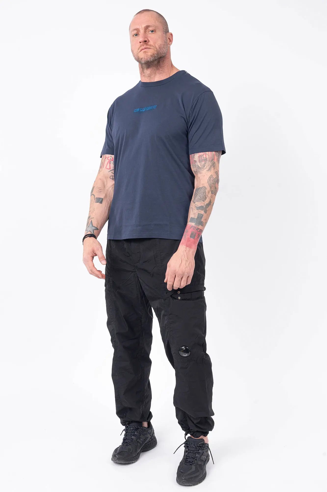 C.P. Company, Mens T-Shirt, Midnight Navy 889, Blue, Chester Perry, Massimo Osti Front and Back Embroidery, Hand Painted Details, Blue Print, CP Company, Short Sleeves, 100% Cotton, Crewneck, Ribbed Neckline, Full Body Front 3/4 View. 