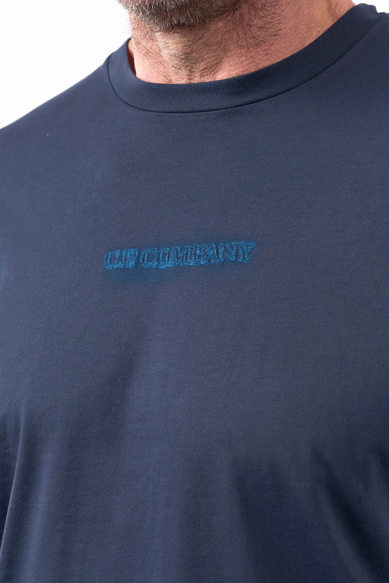 C.P. Company, Mens T-Shirt, Midnight Navy 889, Blue, Chester Perry, Massimo Osti Front and Back Embroidery, Hand Painted Details, Blue Print, CP Company, Short Sleeves, 100% Cotton, Crewneck, Ribbed Neckline, Front Embroidery Close-up. 