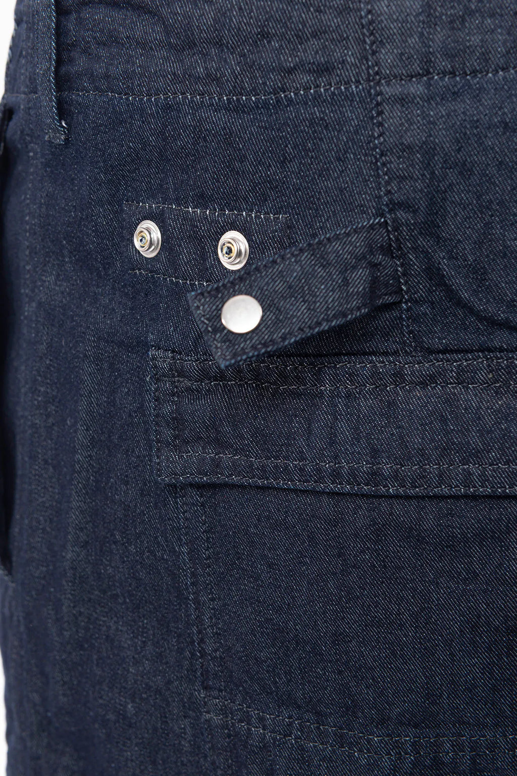 C.P. Company, Mens Denim Shorts, Denim Blue, Washed, Treated, WASHED 40° D08, Side Pockets, Back Pockets, Logo Patches, Belt Loops, Button Closure, Cotton, Polyester, Hem Snap Adjustment Straps Close-up. 