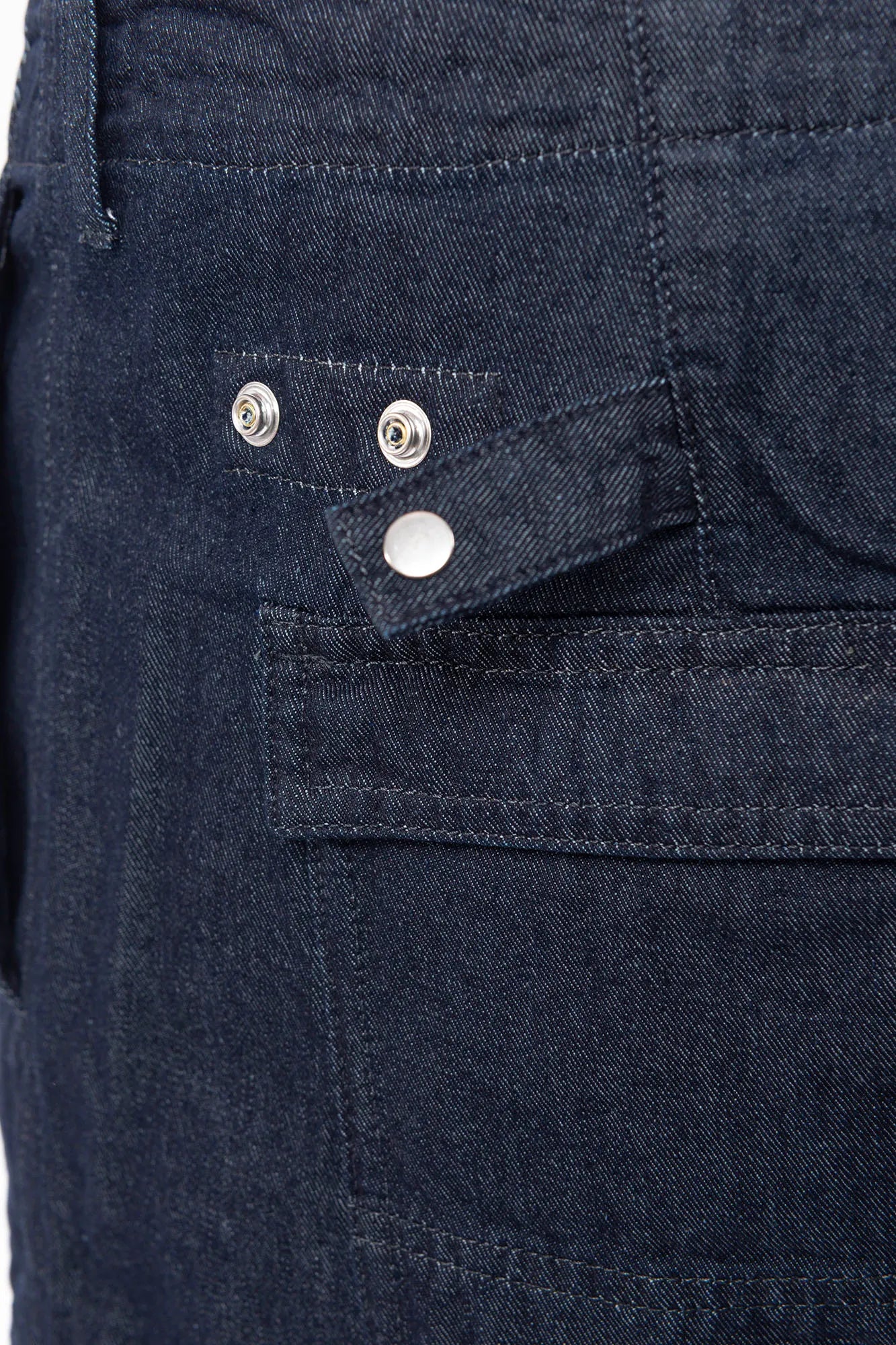C.P. Company, Mens Denim Shorts, Denim Blue, Washed, Treated, WASHED 40° D08, Side Pockets, Back Pockets, Logo Patches, Belt Loops, Button Closure, Cotton, Polyester, Hem Snap Adjustment Straps Close-up. 
