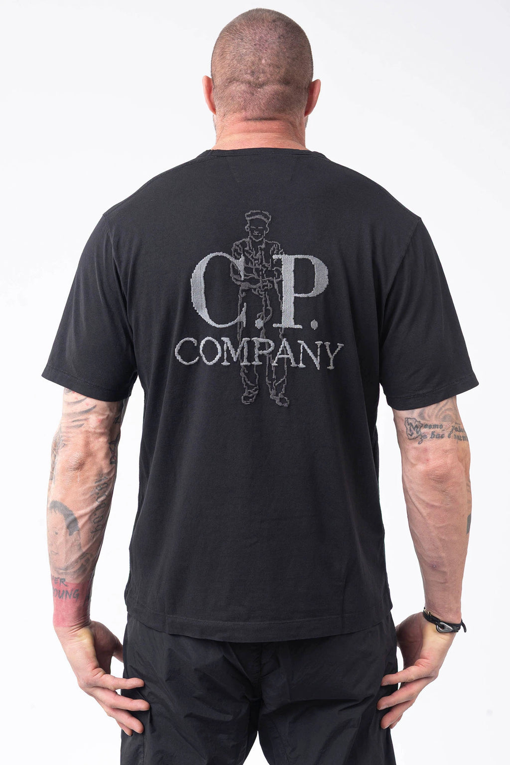 C.P. Company, Mens T-Shirt, Black 999, Logo Embroidery, British Sailor, Back Embroidery, Grey Stitching, Short Sleeves, 100% Organic Cotton, Ribbed Hem and Neck, Standard Fit, Back Portrait. 