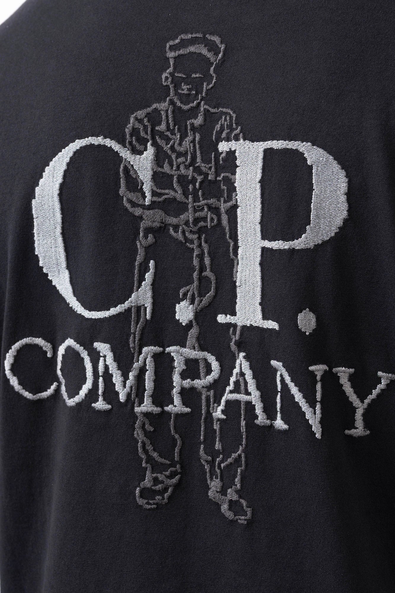 C.P. Company, Mens T-Shirt, Black 999, Logo Embroidery, British Sailor, Back Embroidery, Grey Stitching, Short Sleeves, 100% Organic Cotton, Ribbed Hem and Neck, Standard Fit, Back Embroidery Close-up. 