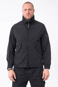 C.P. Company, Mens Jacket, Black 999, Concealed Hood, Chrome-R, Polyamide, Full-Zip, Side Flap Pockets, Sleeve Lens Pocket, Centre Zip Closure, Long Sleeves, Ribbed Elastic Cuffs, Branded Zip Puller, YKK Zippers, Front Portrait. 