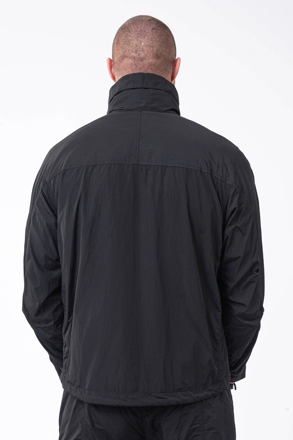 C.P. Company, Mens Jacket, Black 999, Concealed Hood, Chrome-R, Polyamide, Full-Zip, Side Flap Pockets, Sleeve Lens Pocket, Centre Zip Closure, Long Sleeves, Ribbed Elastic Cuffs, Branded Zip Puller, YKK Zippers, Two-Way Zipper, Back Portrait. 