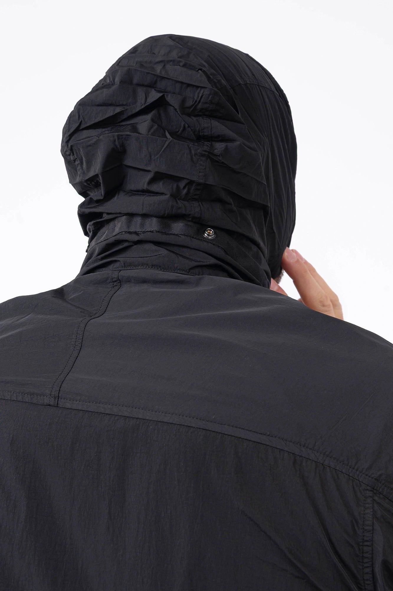 C.P. Company, Mens Jacket, Black 999, Concealed Hood, Chrome-R, Polyamide, Full-Zip, Side Flap Pockets, Sleeve Lens Pocket, Centre Zip Closure, Long Sleeves, Ribbed Elastic Cuffs, Branded Zip Puller, YKK Zippers, Two-Way Zipper, Back View Hood Showcase. 