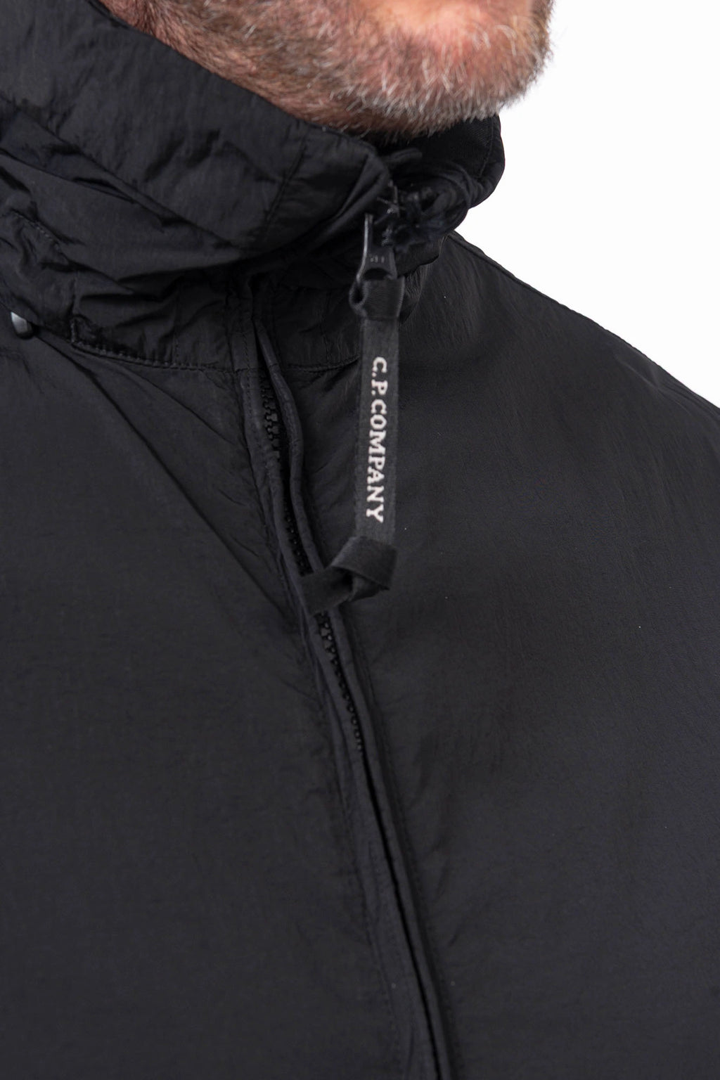 C.P. Company, Mens Jacket, Black 999, Concealed Hood, Chrome-R, Polyamide, Full-Zip, Side Flap Pockets, Sleeve Lens Pocket, Centre Zip Closure, Long Sleeves, Ribbed Elastic Cuffs, Branded Zip Puller, YKK Zippers, Two-Way Zipper, Branded Zipper Close-up. 