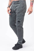 C.P. Company, Mens Pants, Gunmetal 921, Grey, Gray, Cargo Pockets, Stretch Cotton Sateen, Snap Closure Cargo Pockets, Side Pockets, Back Pockets, Belt Loops, Button Closure, Zip-Fly, Massimo Osti, Chester Perry, British Saylor, Signature Lens, Lens Pocket, Front 3/4 View Step Forward. 