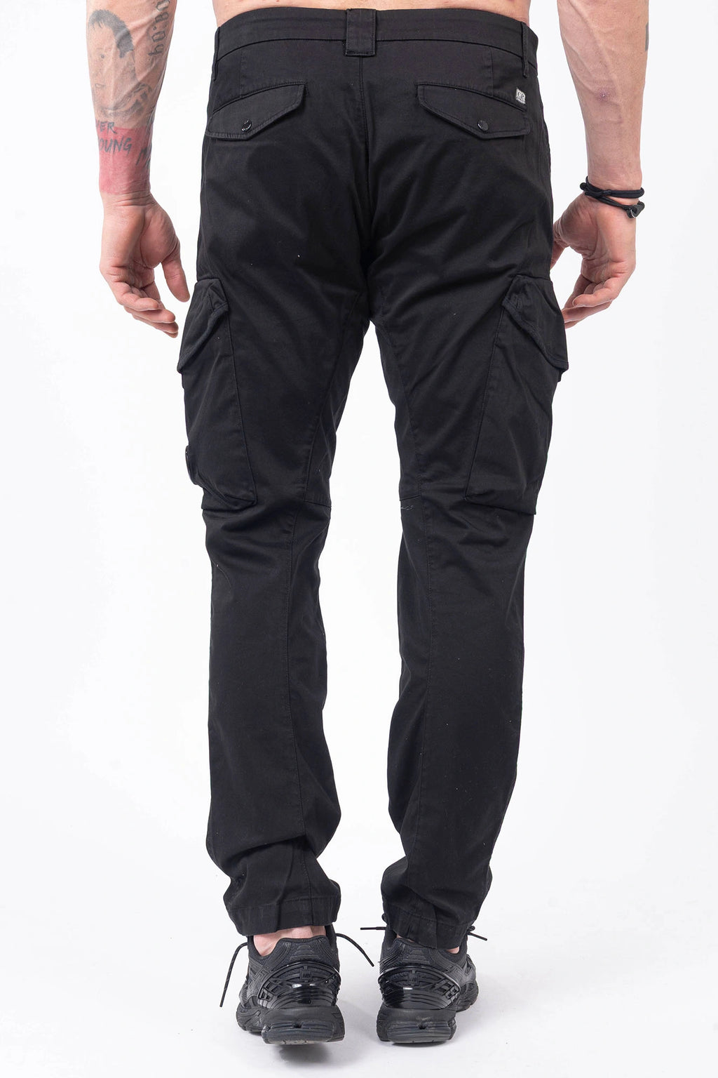 C.P. Company, Mens Cargo Pants, Black 999, Stretch Cotton Satin, Elastic, Cargo Pockets, Side Pockets, Belt Loops, Button Closure, Zip-Fly, Lens Pocket Detail, Massimo Osti, Chester Perry, British Saylor, Back Portrait. 