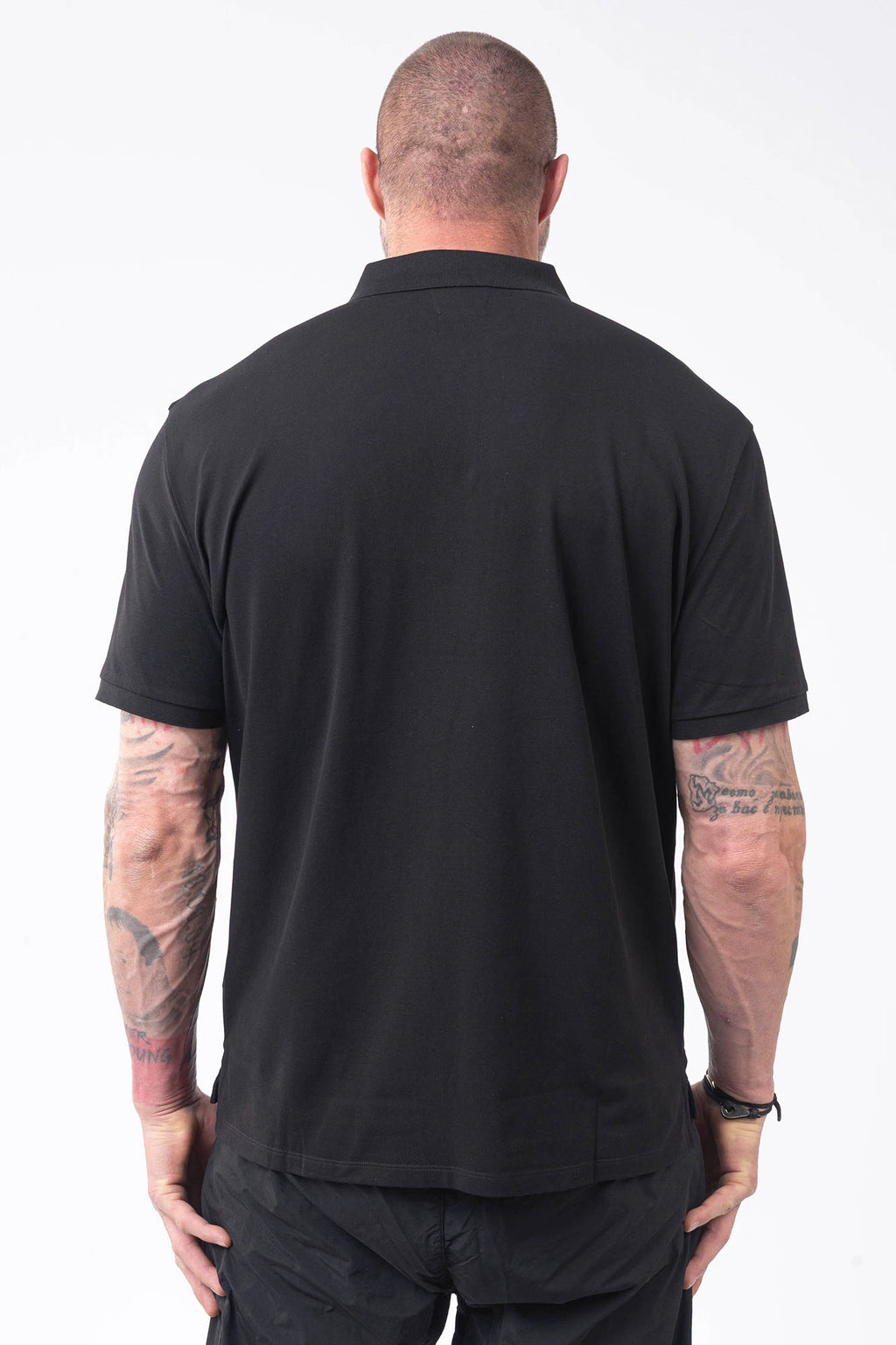C.P. Company, Mens Polo Shirt, Black 999, Collar, Button Closure, Short Sleeves, Ribbed Hems, Stretch Cotton Pique, Chest Embroidery, Chester Perry, Massimo Osti, British Saylor, Rigards Sunglasses, Back Portrait. 