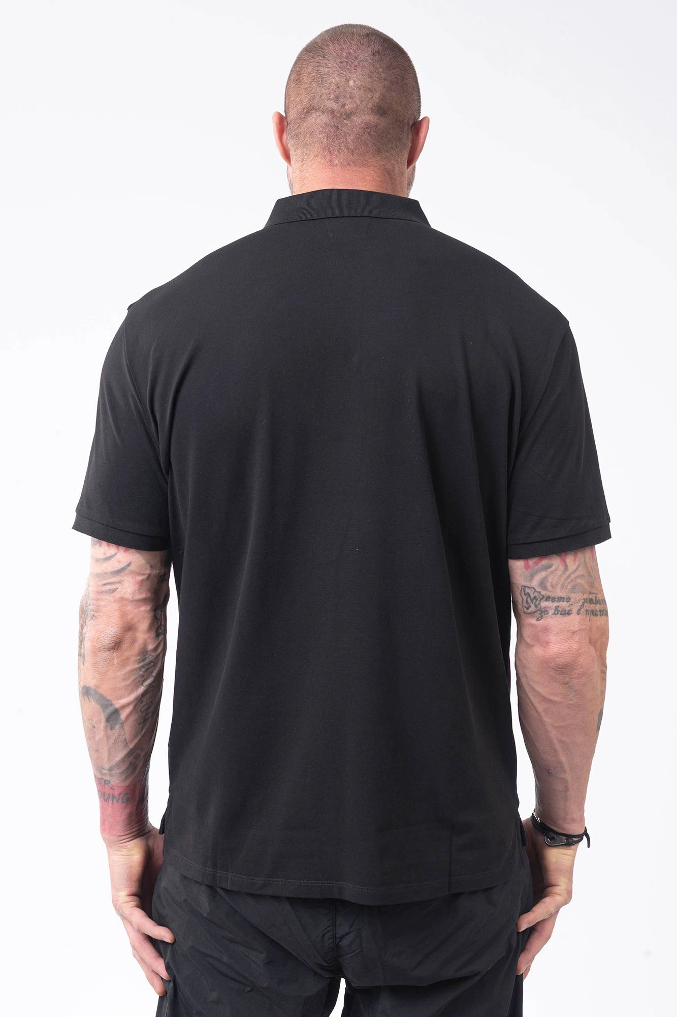 C.P. Company, Mens Polo Shirt, Black 999, Collar, Button Closure, Short Sleeves, Ribbed Hems, Stretch Cotton Pique, Chest Embroidery, Chester Perry, Massimo Osti, British Saylor, Rigards Sunglasses, Back Portrait. 