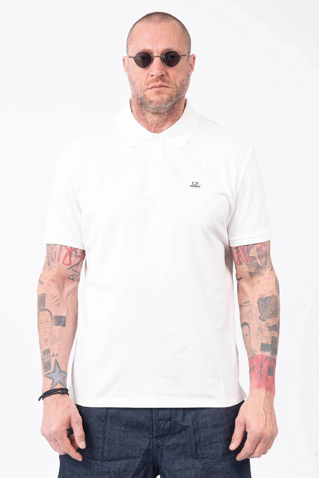 C.P. Company, Mens Polo Shirt, Gauze White 103, Collar, Button Closure, Short Sleeves, Ribbed Hems, Stretch Cotton Pique, Chest Embroidery, Chester Perry, Massimo Osti, British Saylor, Rigards Sunglasses, Front Portrait. 