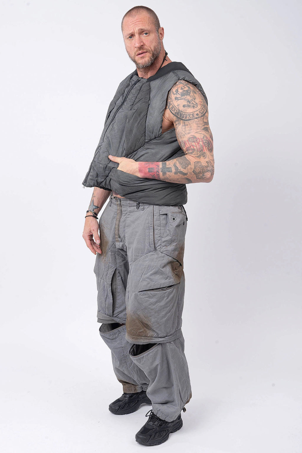 Hamcus, Mens Vest, Washed Grey, Sleeveless, Padded, Full-Zip, Multiple Zip Pockets, Breathable Design, Elastic Drawcord Adjustable Waist, Back Ventilation Cutoff, Centre Zip Closure, Full Zip, Garment Dyed, Insulated, Panel Construction, Full Body Front 3/4 View. 