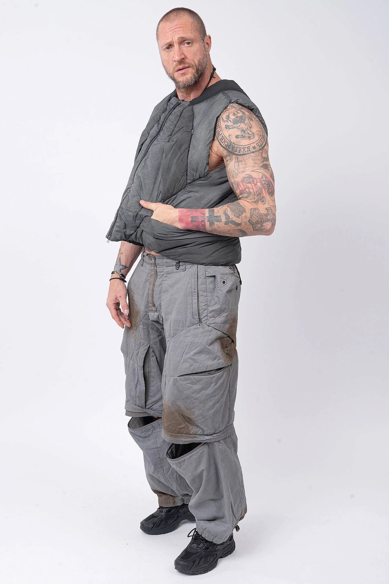 Hamcus, Mens Vest, Washed Grey, Sleeveless, Padded, Full-Zip, Multiple Zip Pockets, Breathable Design, Elastic Drawcord Adjustable Waist, Back Ventilation Cutoff, Centre Zip Closure, Full Zip, Garment Dyed, Insulated, Panel Construction, Full Body Front 3/4 View. 