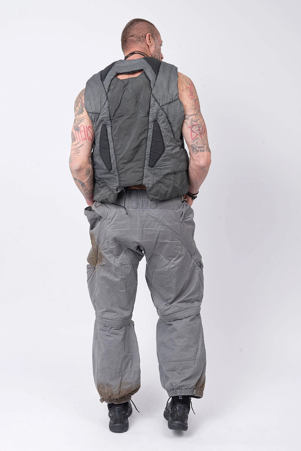Hamcus, Mens Vest, Washed Grey, Sleeveless, Padded, Full-Zip, Multiple Zip Pockets, Breathable Design, Elastic Drawcord Adjustable Waist, Back Ventilation Cutoff, Centre Zip Closure, Full Zip, Garment Dyed, Insulated, Panel Construction, Full Body Back View. 