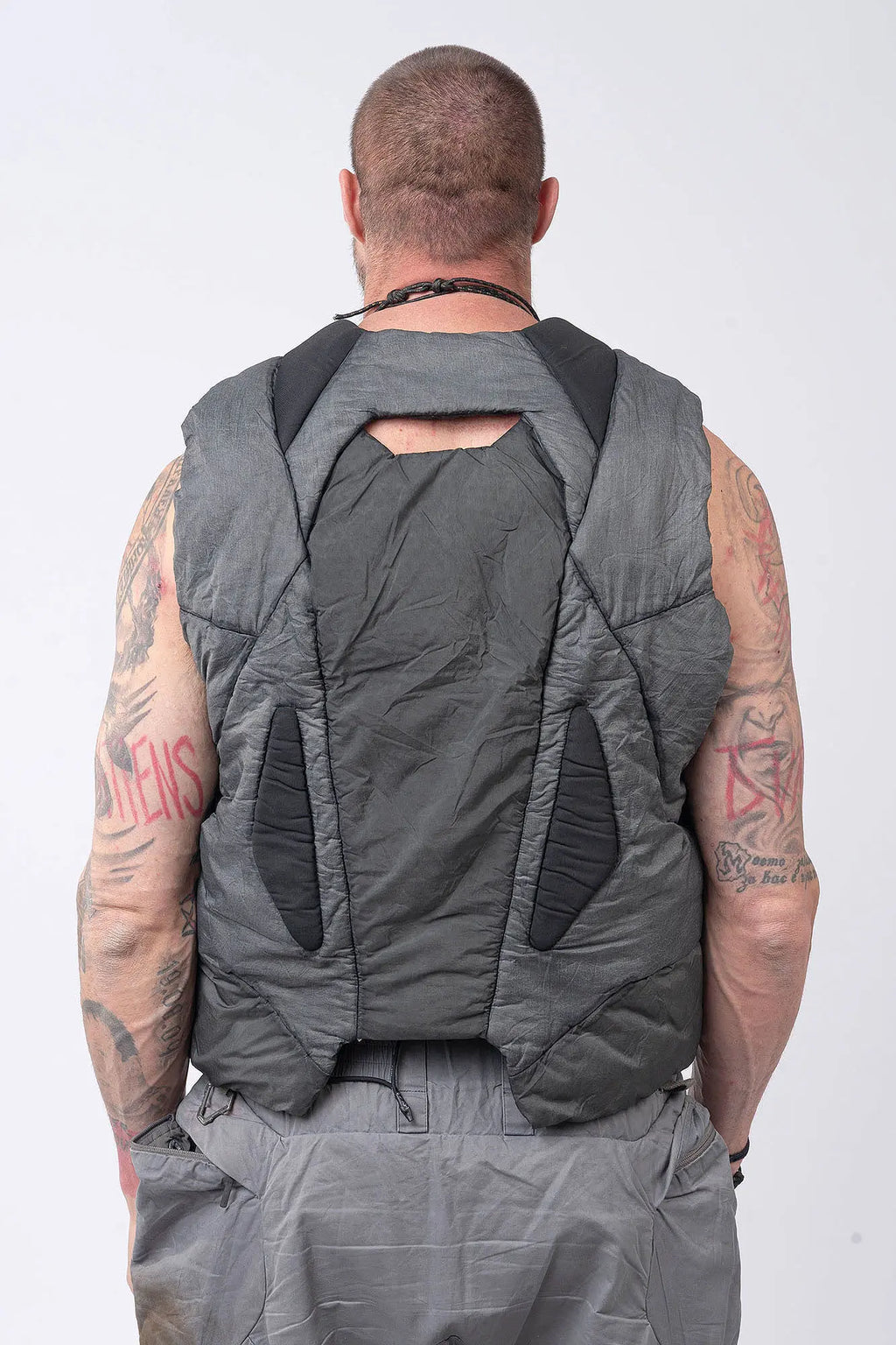 Hamcus, Mens Vest, Washed Grey, Sleeveless, Padded, Full-Zip, Multiple Zip Pockets, Breathable Design, Elastic Drawcord Adjustable Waist, Back Ventilation Cutoff, Centre Zip Closure, Full Zip, Garment Dyed, Insulated, Panel Construction, Back Portrait. 
