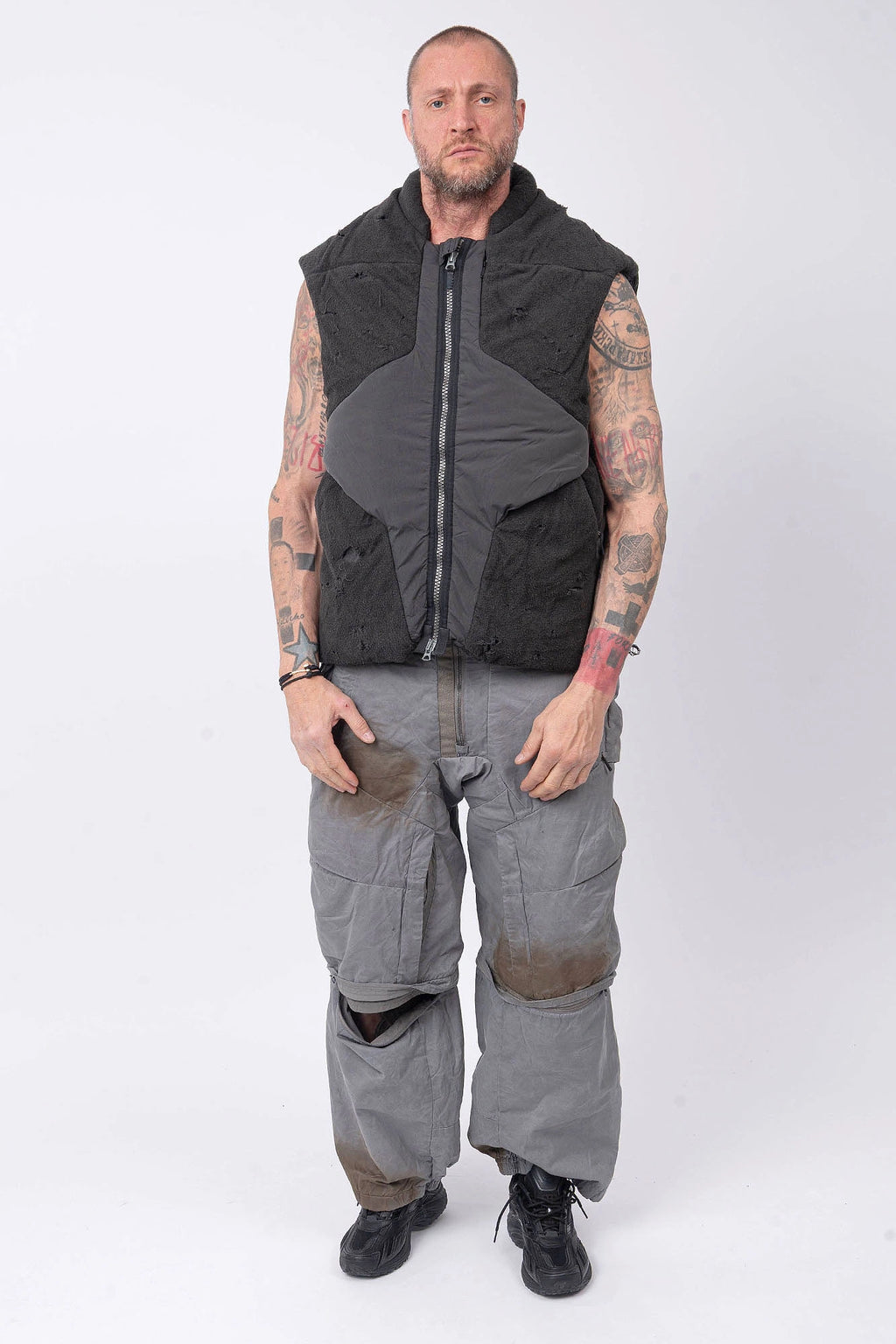 Hamcus, Mens Vest, Matte Black, Multi-Fabric Blend, Panel Construction, Patchwork Design, Heavy-Duty Vislon Zipper, Worn Appearance, Functional Pockets, Hidden Pockets, Breathable, Back LP World Print, Full Body Front View. 