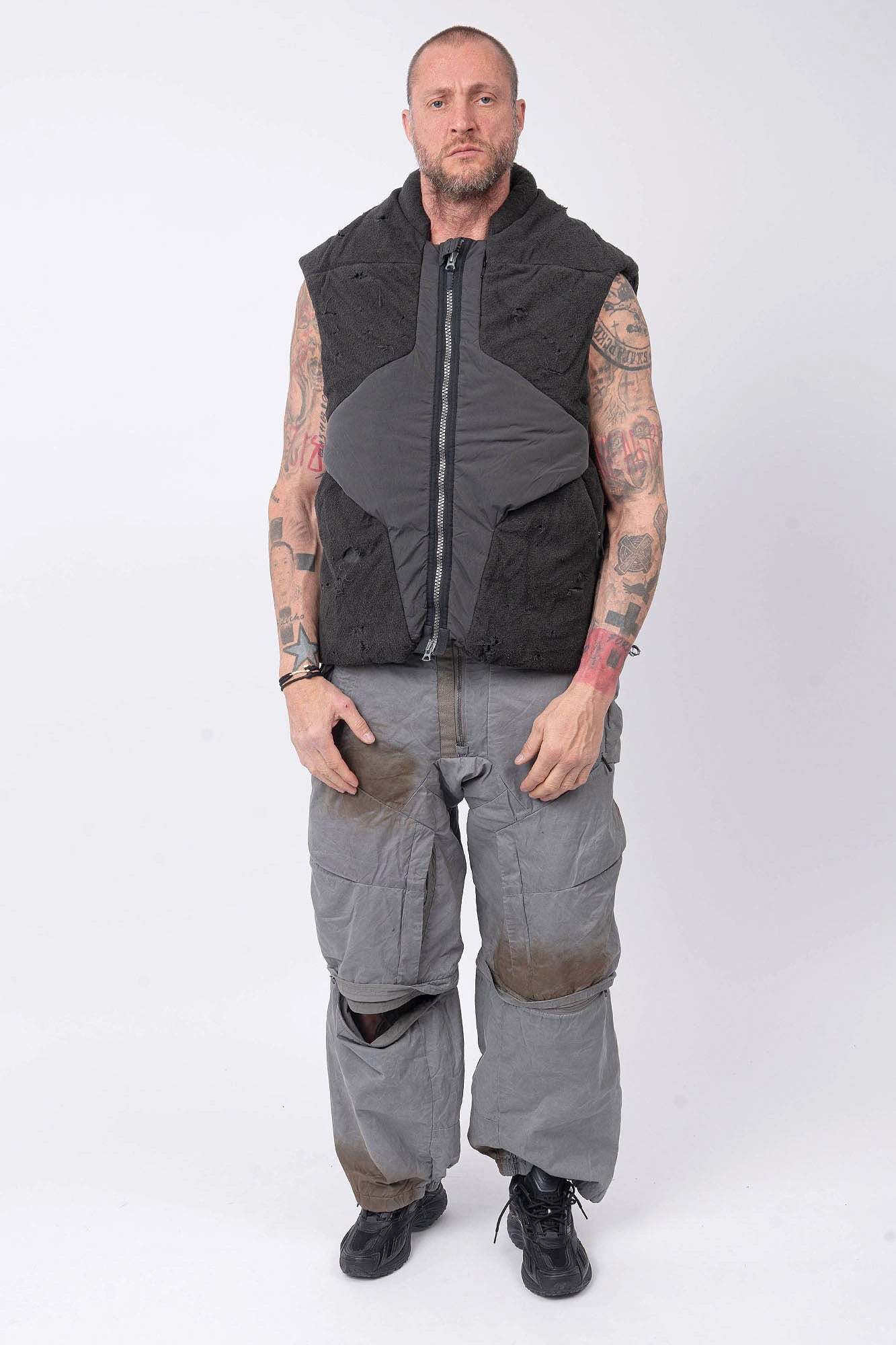Hamcus, Mens Vest, Matte Black, Multi-Fabric Blend, Panel Construction, Patchwork Design, Heavy-Duty Vislon Zipper, Worn Appearance, Functional Pockets, Hidden Pockets, Breathable, Back LP World Print, Full Body Front View. 