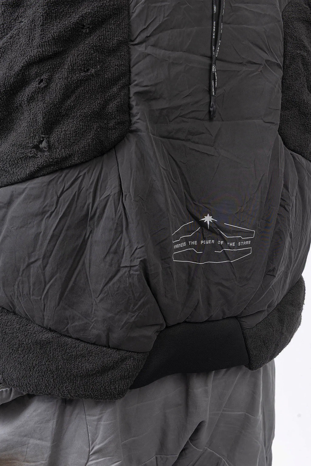 Hamcus, Mens Vest, Matte Black, Multi-Fabric Blend, Panel Construction, Patchwork Design, Heavy-Duty Vislon Zipper, Worn Appearance, Functional Pockets, Hidden Pockets, Breathable, Back LP World Print, Back Print Close-up. 
