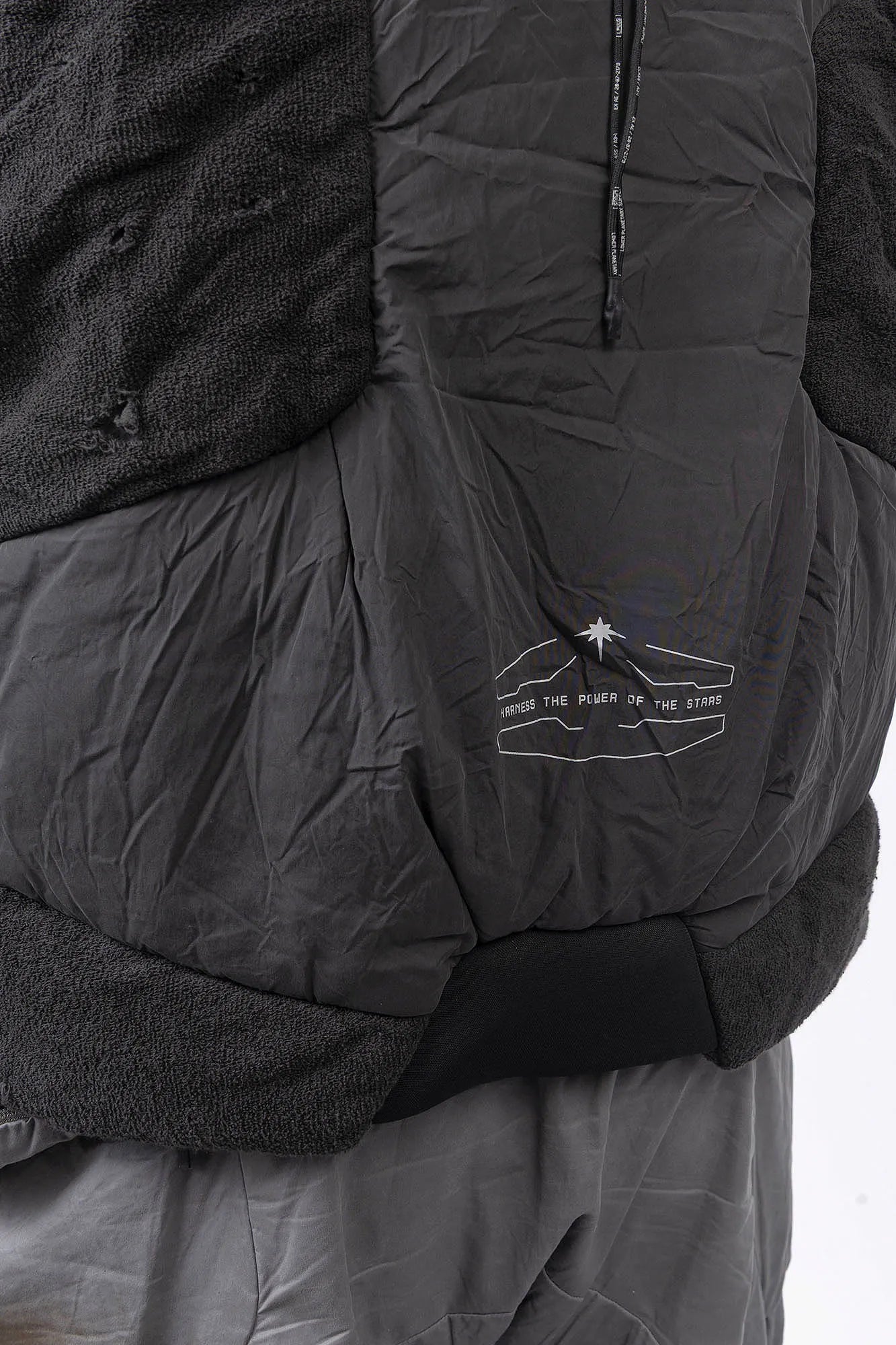 Hamcus, Mens Vest, Matte Black, Multi-Fabric Blend, Panel Construction, Patchwork Design, Heavy-Duty Vislon Zipper, Worn Appearance, Functional Pockets, Hidden Pockets, Breathable, Back LP World Print, Back Print Close-up. 
