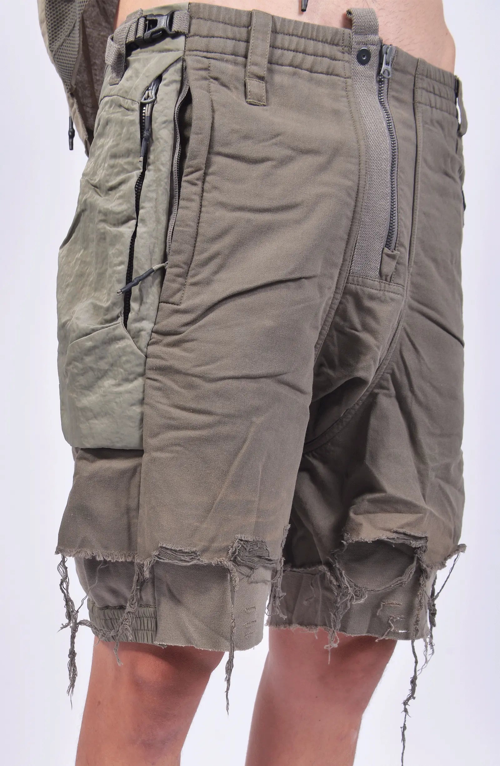 Hamcus, Mens Shorts, Beige, Agate Grey, Olive Green, Zip-Fly, Multiple Pockets, Cargo, Back Pockets, Belt Loops, Elastic Waistband, Raw Details, Short Pants, Unisex, Close-up Front 3/4 View. 