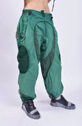 Hamcus, Mens Pants, Green, Garment Dyed, Multi Fabric Panel Construction, Elasticated Waistband, Cord Adjustable, Buckles, Side Mesh Panels, Elasticated Cuffs, Adjustable Cuffs, Long Sleeves, Ventilated, Side Pockets, Zippers, Zip-Fly, Front 3/4 View. 