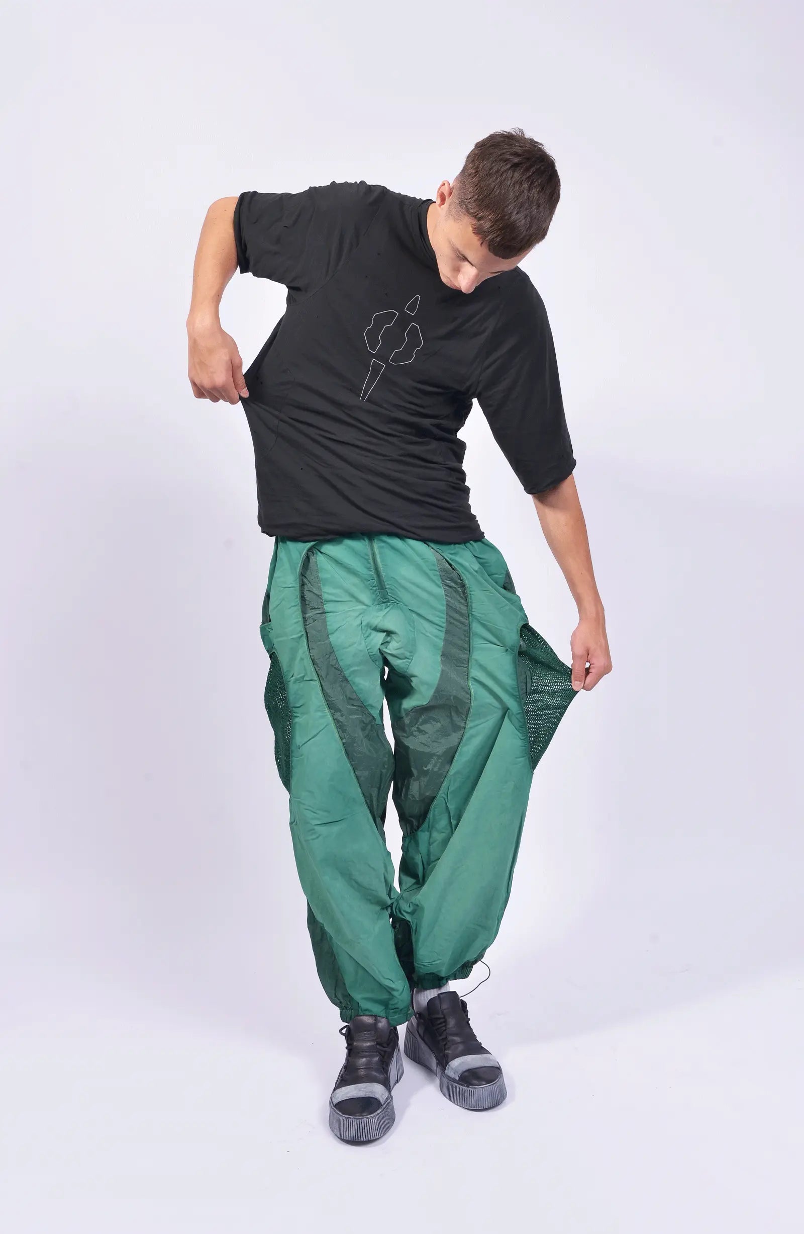 Hamcus, Mens Pants, Green, Garment Dyed, Multi Fabric Panel Construction, Elasticated Waistband, Cord Adjustable, Buckles, Side Mesh Panels, Elasticated Cuffs, Adjustable Cuffs, Long Sleeves, Ventilated, Side Pockets, Zippers, Zip-Fly, Full Body Front View. 