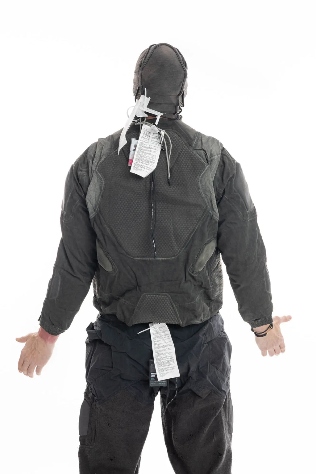 Hamcus, Mens Jacket, Dark Grey, Grey, Multicolor, Garment-Dyed, Detachable Sleeves, Adjustable Cuffs, Skimask, Module Construction, Wearable Sponge Panels, Side Zip Pockets, Multiple Zippers, Multiple Pockets, Back View Hands to the Side. 