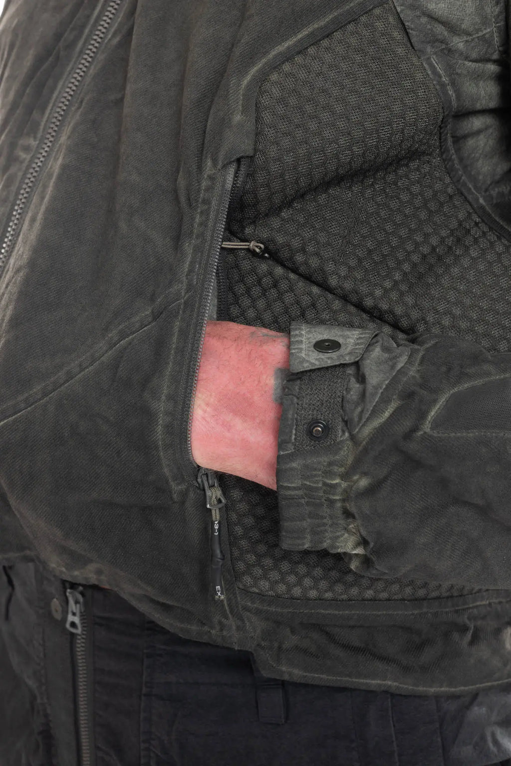 Hamcus, Mens Jacket, Dark Grey, Grey, Multicolor, Garment-Dyed, Detachable Sleeves, Adjustable Cuffs, Skimask, Module Construction, Wearable Sponge Panels, Side Zip Pockets, Multiple Zippers, Multiple Pockets, Hand in Side Pocket Close-up. 