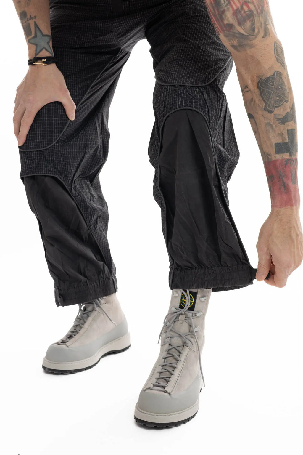 Hamcus, Mens Trousers, Black, Elastic Panels, Zipper Ventilation Openings, Mesh Panels, Elastic, Drawcord Waist, Adjustable Cuffs, Side Zip Pockets, Zip Fly, Belt Loops, Snap Closure, Wide Fit, Straight Legs, Elastic Cuffs, Cuff Adjustment Close-up. 