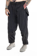 Hamcus, Mens Trousers, Black, Elastic Panels, Zipper Ventilation Openings, Mesh Panels, Elastic, Drawcord Waist, Adjustable Cuffs, Side Zip Pockets, Zip Fly, Belt Loops, Snap Closure, Wide Fit, Straight Legs, Elastic Cuffs, Front View Hand in Pocket. 