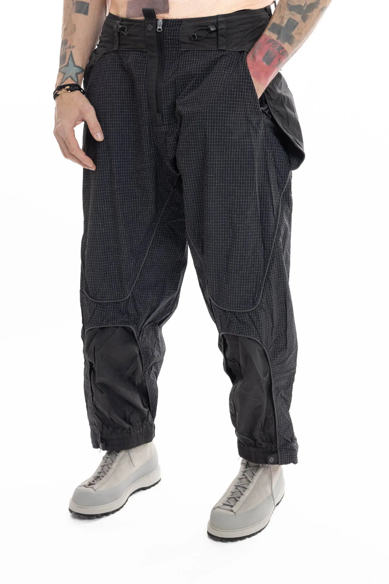 Hamcus, Mens Trousers, Black, Elastic Panels, Zipper Ventilation Openings, Mesh Panels, Elastic, Drawcord Waist, Adjustable Cuffs, Side Zip Pockets, Zip Fly, Belt Loops, Snap Closure, Wide Fit, Straight Legs, Elastic Cuffs, Front View Hand in Pocket. 