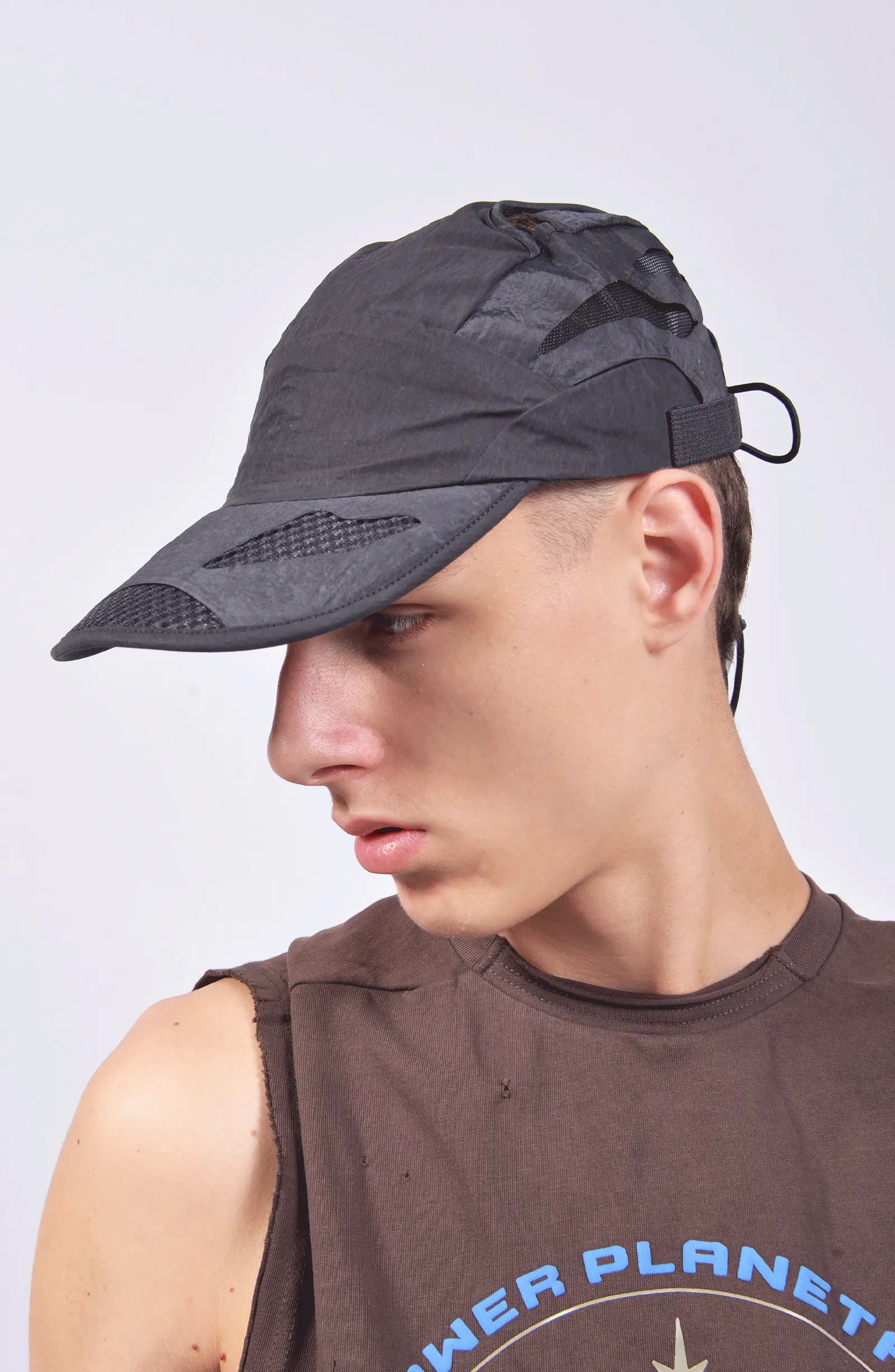 Hamcus, Mens Cap, Black, Grey, Mesh, Breathability Holes, Laser Cut, Fidlock Adjustment Buckle, Ventilated, Breathable, On-Model Shot Looking Sideways. 