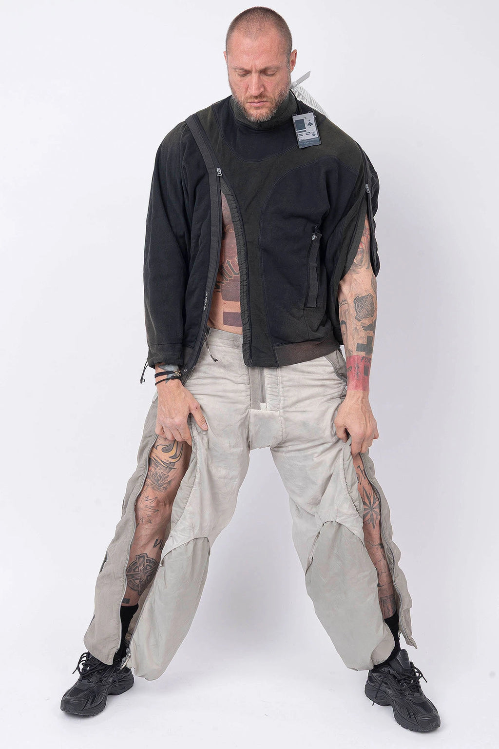 Hamcus, Mens Pullover, Black, Olive Green, Dual Long Zippers, Hybrid Garment, Convertible Garment, Long Sleeves, Adjustable Drawcord Cuffs, Ribbed Cuffs and Hem, Ventilation Design, Breathable, Modular, Multi-Functional, Full Body Front View.  