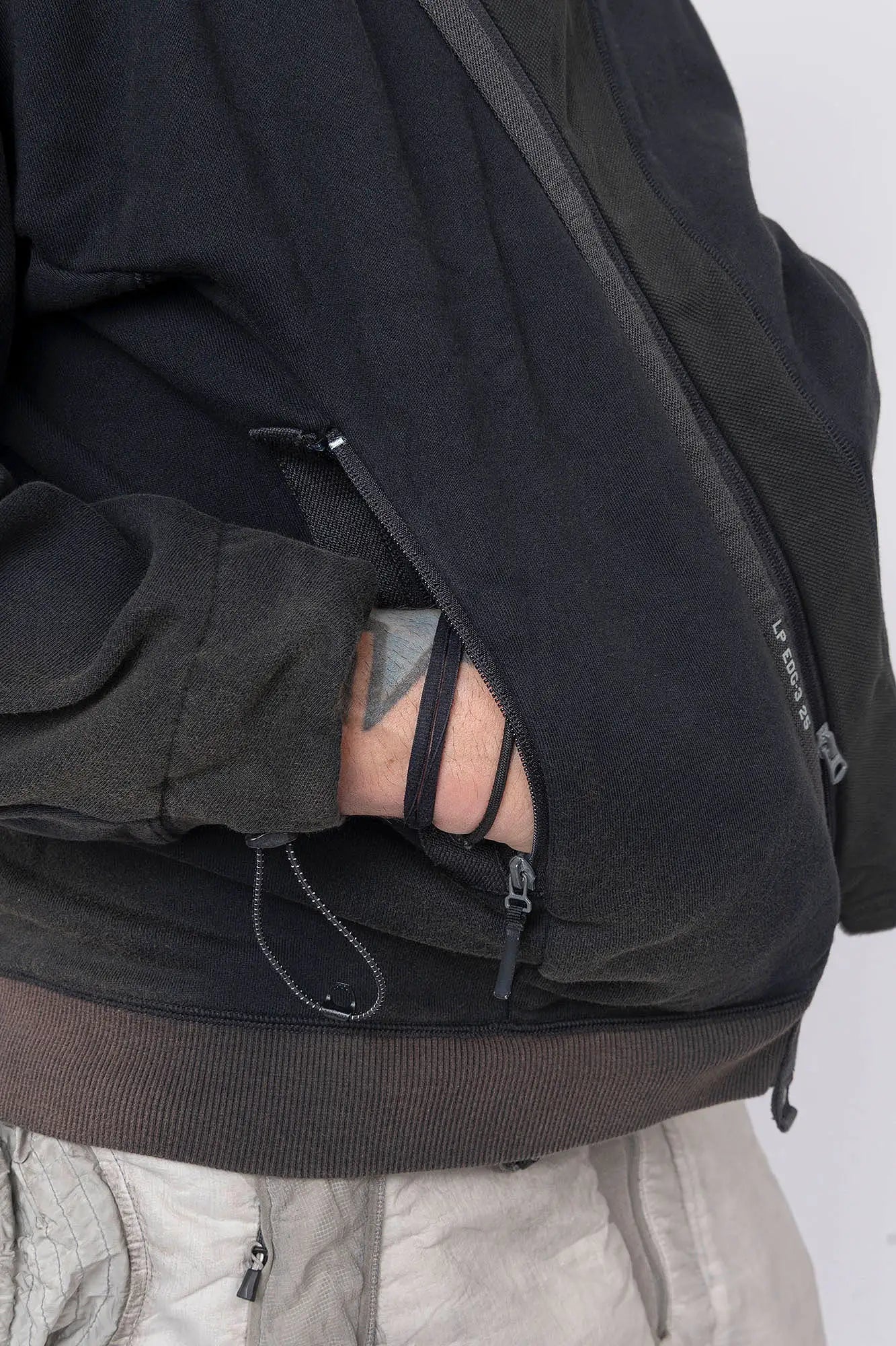 Hamcus, Mens Pullover, Black, Olive Green, Dual Long Zippers, Hybrid Garment, Convertible Garment, Long Sleeves, Adjustable Drawcord Cuffs, Ribbed Cuffs and Hem, Ventilation Design, Breathable, Modular, Multi-Functional, Zip Pockets, Hand in Pocket. 