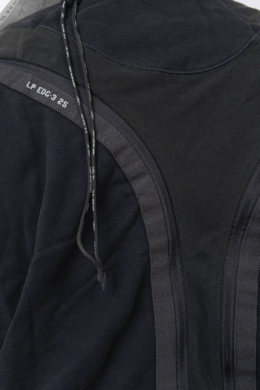Hamcus, Mens Pullover, Black, Olive Green, Dual Long Zippers, Hybrid Garment, Convertible Garment, Long Sleeves, Adjustable Drawcord Cuffs, Ribbed Cuffs and Hem, Ventilation Design, Breathable, Modular, Multi-Functional, Back Panels Close-up. 