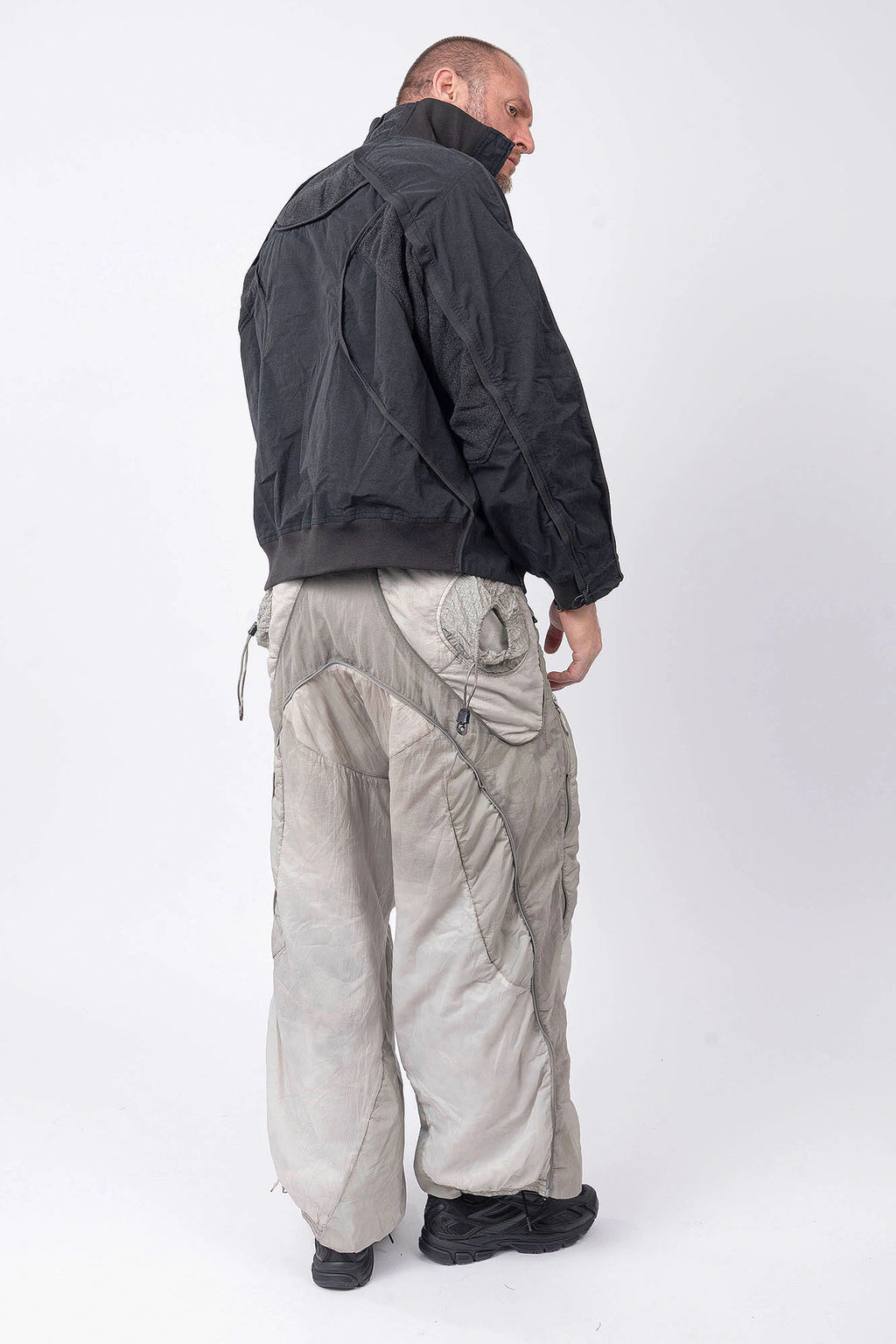 Hamcus, Mens Pullover, Matte Black, Dark Grey, Dark Gray, Half-Zip, Quarter-Zip, Long Sleeves, Mock Neck, Symmetric Panel Design, Ribbed Hem and Sleeve Cuffs, Side Pockets, Elastic Drawcord Adjustable Cuffs with Cordstoppers, Ribbed Neck, Back LP World Print, Full Body Back 3/4 View. 