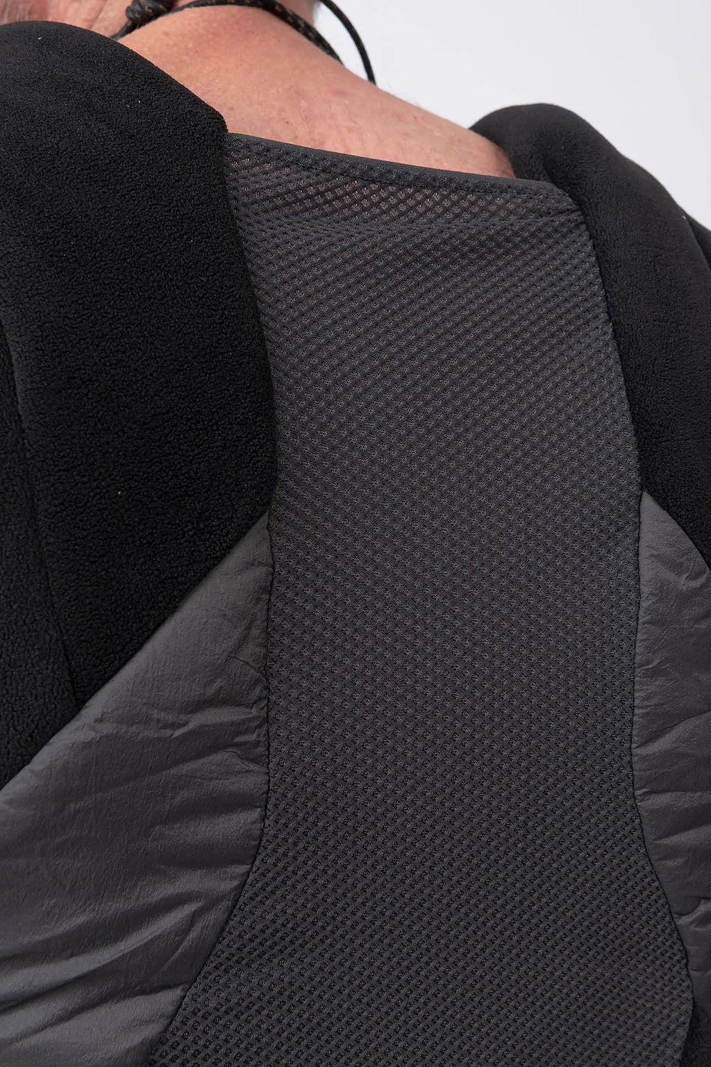 Hamcus, Mens Vest, Black, Fleece, Multi-Fabric Blend, Sleeveless, Full-Zip, Vislon Zipper, Plastic Zipper, Side Pockets, Breathable Back Mesh, Shoulder Zippers, Panel Construction, Patchwork Design, Centre Zip Closure, Ventilated, Ventilation Mesh Close-up. 