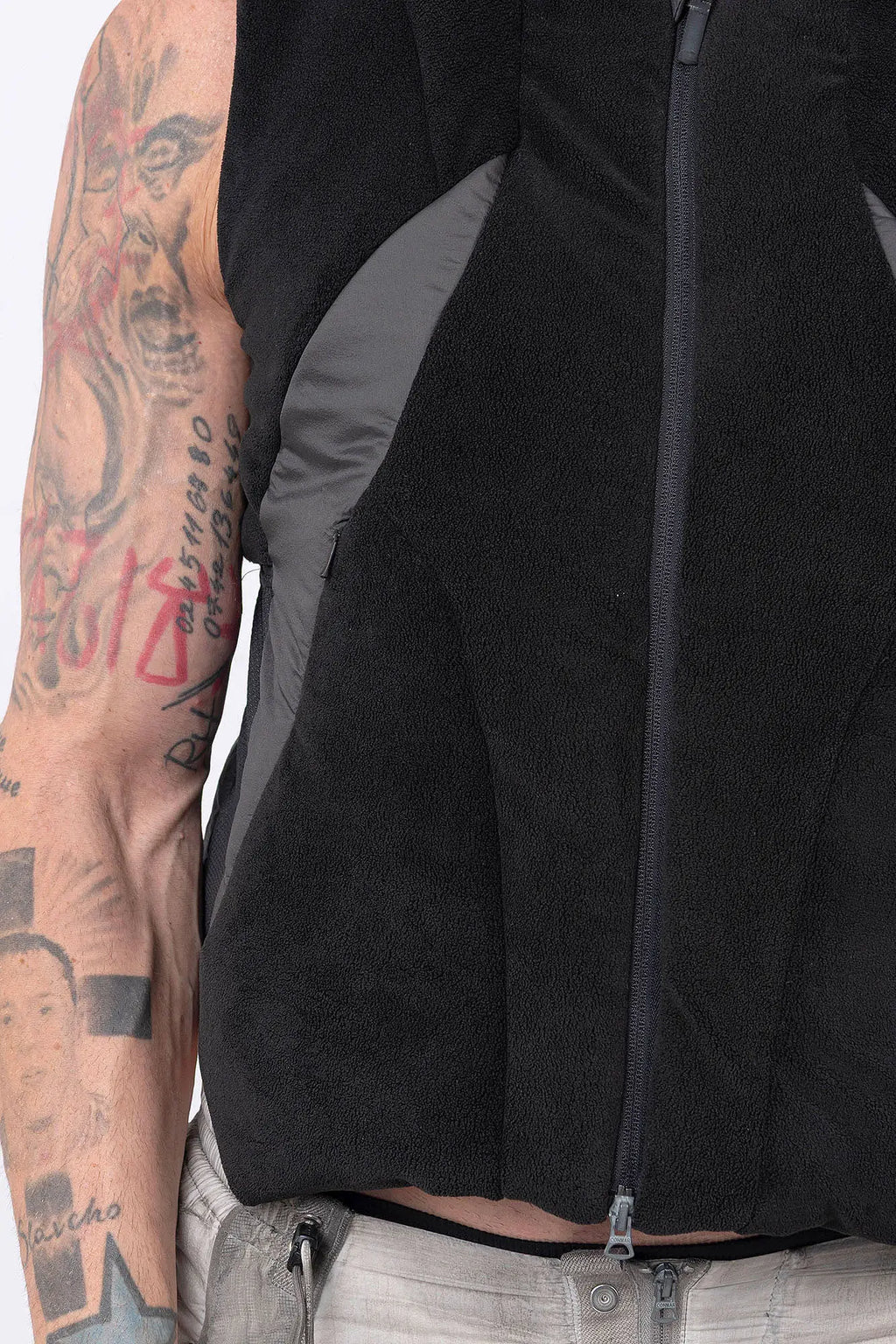 Hamcus, Mens Vest, Black, Fleece, Multi-Fabric Blend, Sleeveless, Full-Zip, Vislon Zipper, Plastic Zipper, Side Pockets, Breathable Back Mesh, Shoulder Zippers, Panel Construction, Patchwork Design, Centre Zip Closure, Ventilated, Close-up Panel Construction Showcase. 