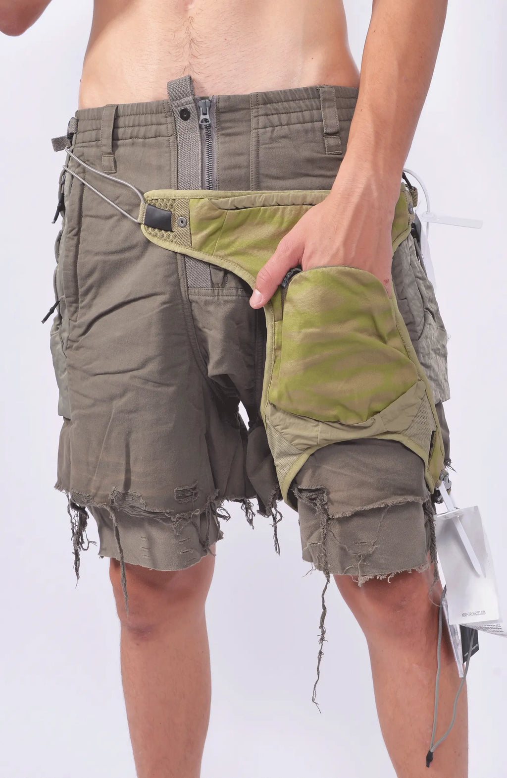 Hamcus, Mens Gun Bag, Yellow, Green, Washed, Camo, Waterproof, Unisex, Elastic, Leg Straps, Pockets, Zippers, Mesh, Elastic, Polyester, Buckle, Adjustable, On-Model Hand in Pocket View. 