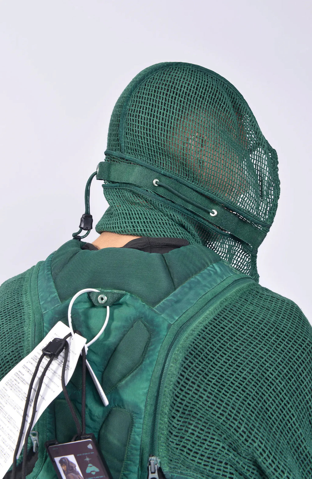 Hamcus, Mens Vest, Ultramarine Green, Mesh, Unisex, Breathable, Hooded, Long Sleeves, Detachable Sleeves, Pockets, Zippers, Zip Pockets, Buckle, Organic Cotton, Polyamide, Polyester, Elastane, Spandex, Elasticated Cuffs, Silver Tone Details, Hooded Mask Back 3/4 Close-up View. 