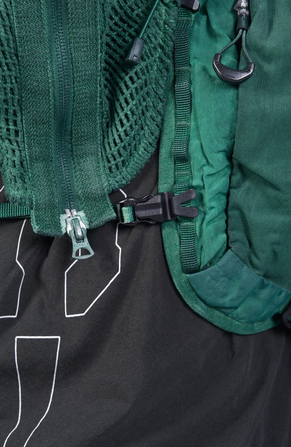 Hamcus, Mens Vest, Ultramarine Green, Mesh, Unisex, Breathable, Hooded, Long Sleeves, Detachable Sleeves, Pockets, Zippers, Zip Pockets, Buckle, Organic Cotton, Polyamide, Polyester, Elastane, Spandex, Elasticated Cuffs, Silver Tone Details, Zip and Buckle Closure Close-up. 