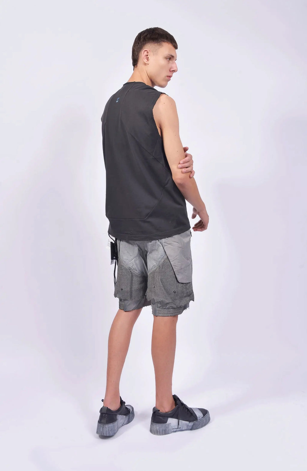 Hamcus, Mens Tank Top, Cloudy Black, Garment Dyed, No Sleeves, Dropped Shoulders, Loose Fit, Cotton, Distressed Fabric, Worn Look, LP World Print, Astro Mining Squad 325, Lower Planetary, Blue and Yellow, Full Body Back 3/4 View. 